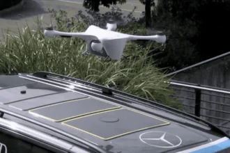 A Mercedes-Benz van in Zurich, Switzerland, with a drone landing on its roof.